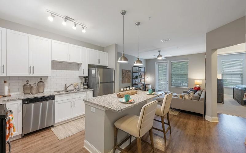 a kitchen with a dining table and chairs