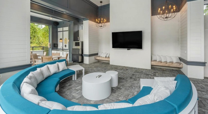 lounge area with a TV