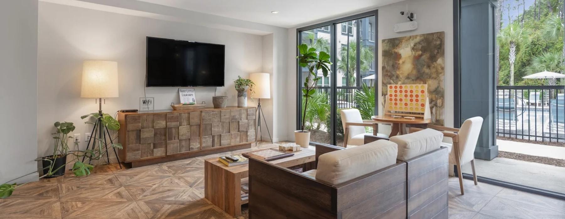 a living room with a tv and couches