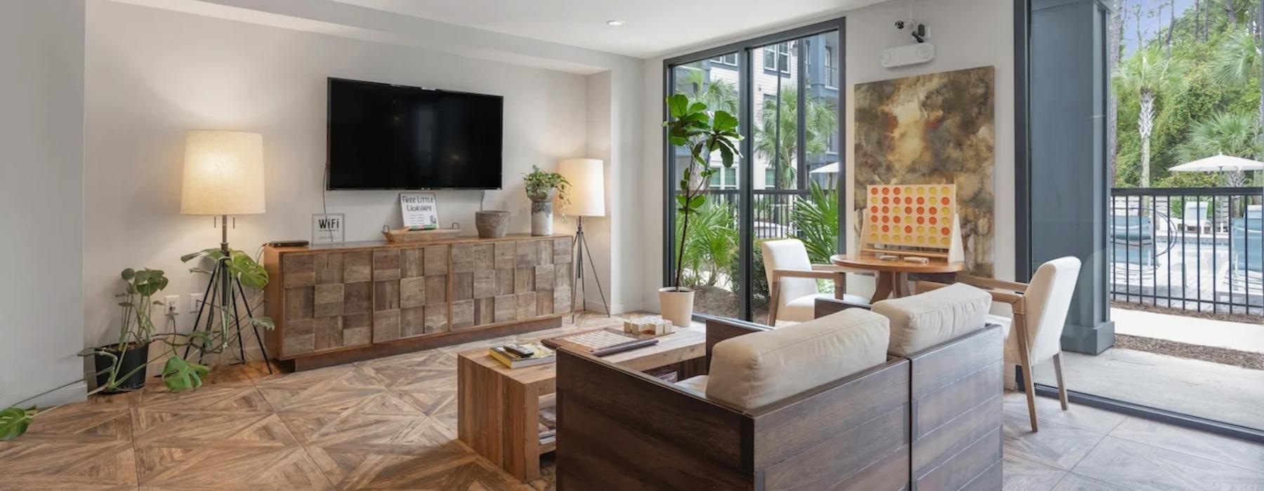 a living room with a tv and couches