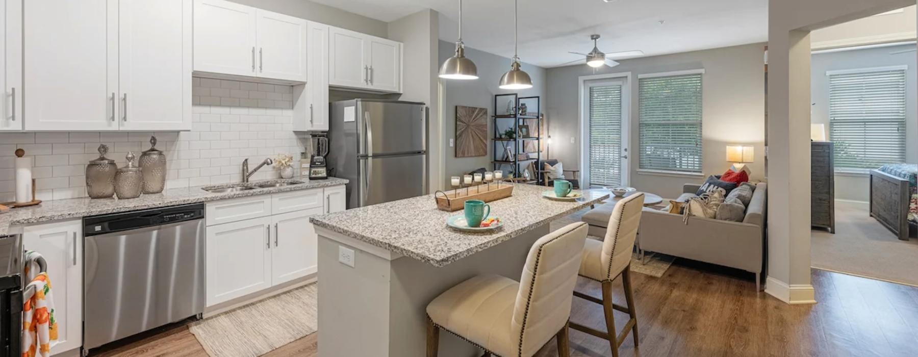 a kitchen with a dining table and chairs