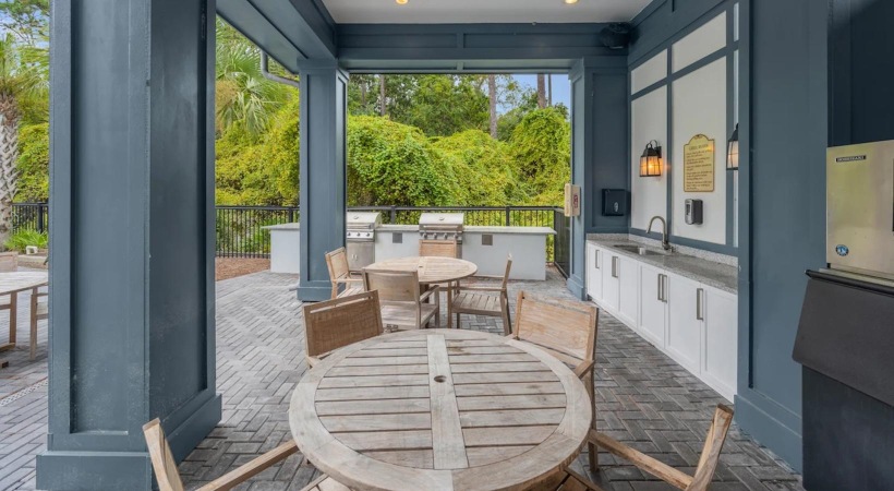 a patio with tables and chairs