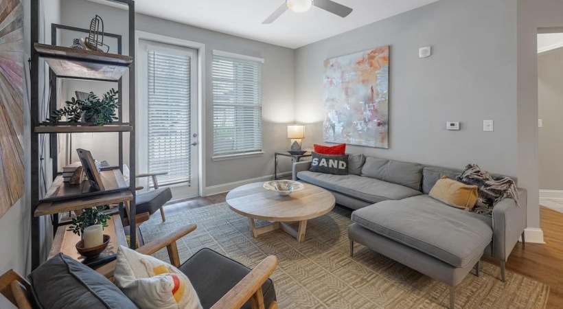 a living room with a ceiling fan